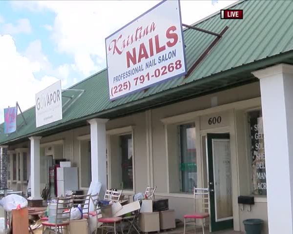 Local Businesses Clean Up After Flood_68814767-159532