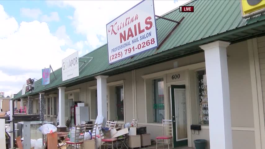 Local Businesses Clean Up After Flood_68814767-159532